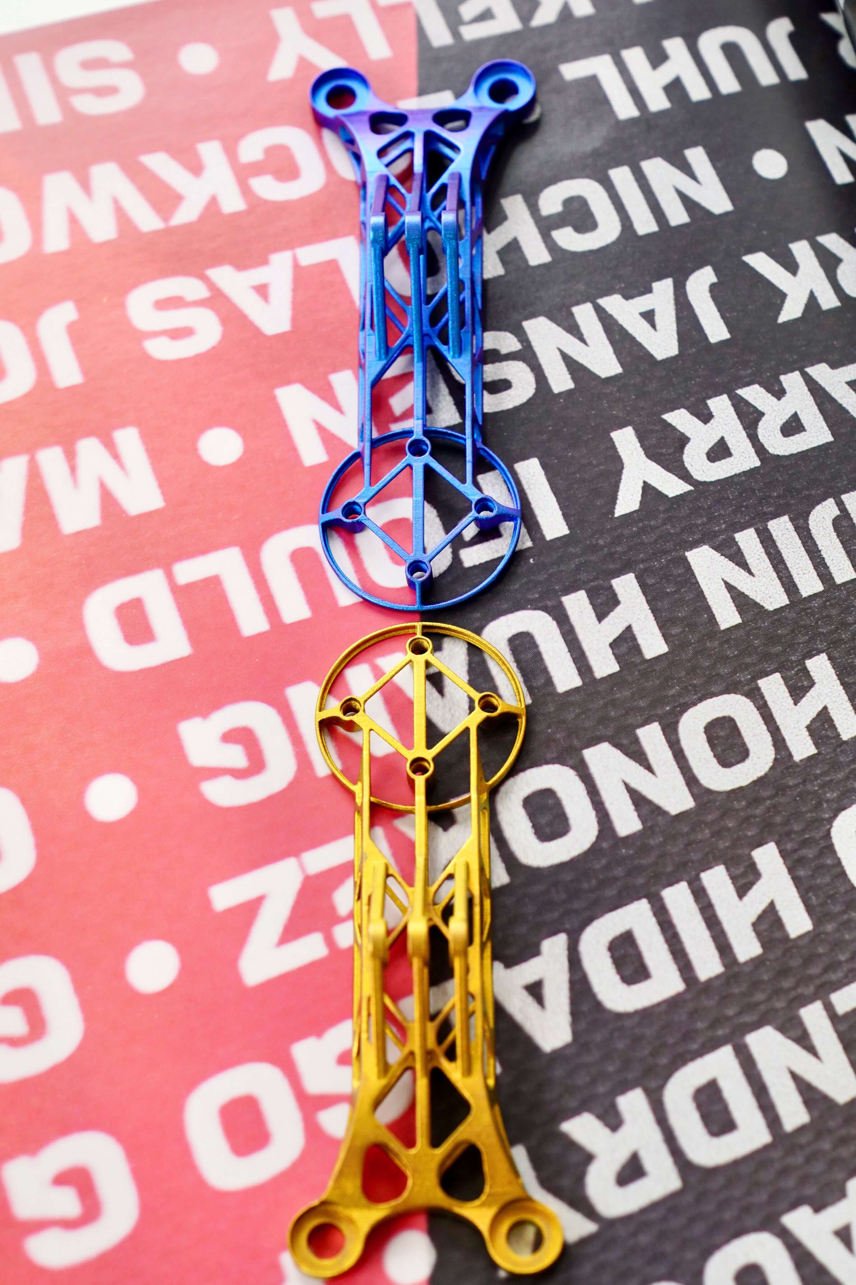 Customize 3D Titanium Bike Computer Mount Color in blue and yellow on a textured background.