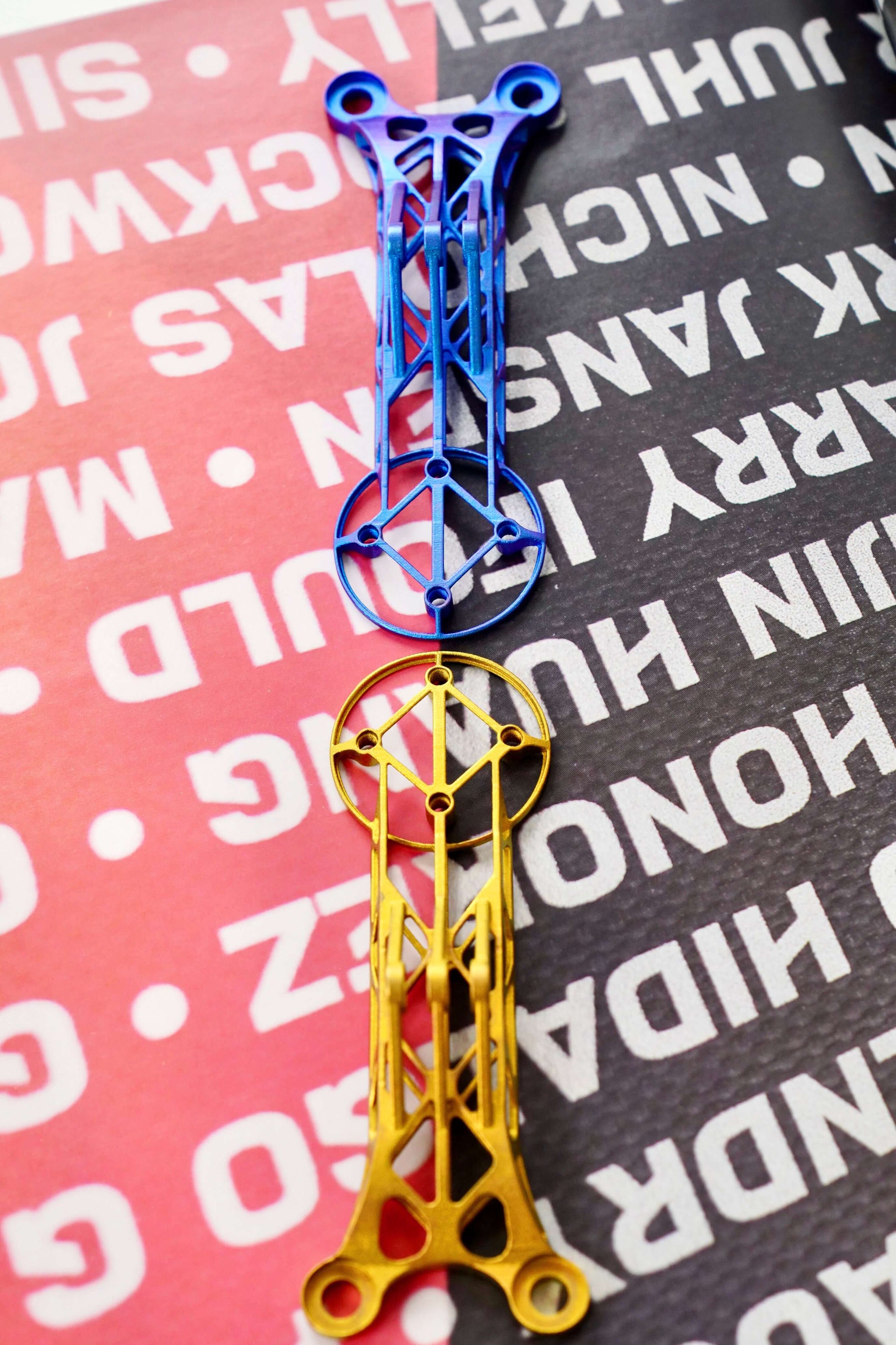 Customize 3D Titanium Bike Computer Mount Color in blue and yellow on a textured background.